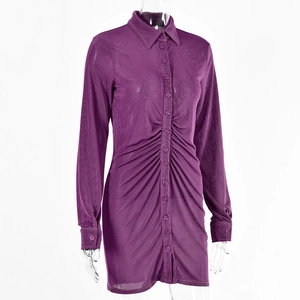 Detail of purple long sleeve dress featuring ruched waist and classic button-down shirt collar