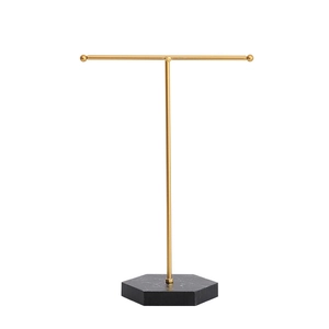 T-bar jewelry display stand with golden metal rack and black marble hexagonal base
