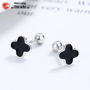 Detail of silver clover stud earrings with black enamel finish and screw ball backings