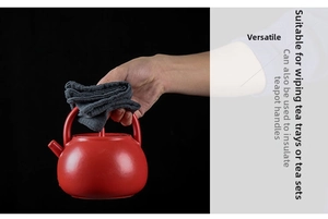 Thick grey absorbent cotton linen tea towel used as a heat-insulated teapot handle pad
