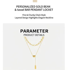 Close-up of double-layered gold chain with bean pendant and tassel square bar detail