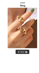 Close-up of double-layered gold-plated stainless steel rings with coffee bean chain design