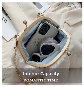 Detail view of the plush rabbit bag interior with golden metal clasp and chain strap