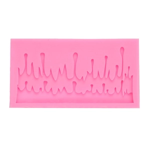 Pink silicone mold featuring melting icicle designs for Christmas cake decorating and DIY