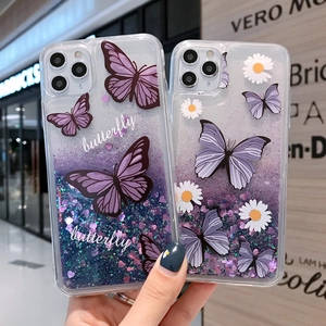 Detail of clear iPhone case with purple glitter liquid, butterflies and daisy patterns