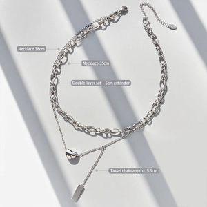 Minimalist double-layer silver-tone necklace with bean pendant and long tassel bar