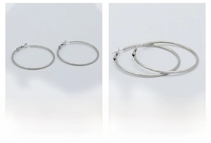 Detailed view of silver stainless steel hoop earrings with polished finish and secure pins