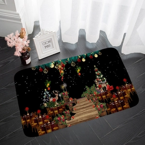 Close-up of Christmas flannel mat with reindeer and tree pattern on dark wood floor