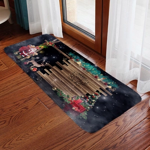 Detail of Christmas flannel mat with Merry Christmas text on dark wood floor