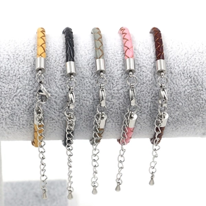 Close-up of anchor leather bracelets in five colors on a velvet display stand
