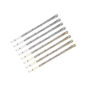 Elegant gold and silver hair pins set with sparkling rhinestones in a minimalist style