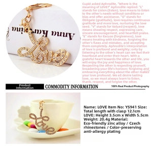Detail view of the sparkling LOVE letter keychain featuring gold plating and Czech rhinestones