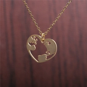 Golden heart-shaped stainless steel pendant with world map cutout on gold chain