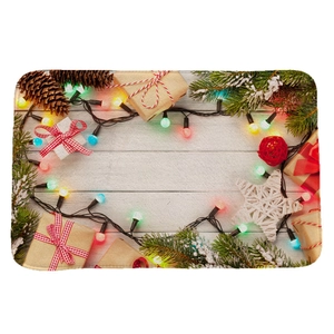 Christmas flannel absorbent mat with pine cones and LED lights on white wood background