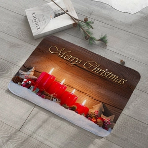 Detail of Christmas flannel mat with red candles and gold Merry Christmas text