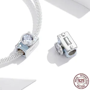 Sparkling S925 sterling silver camera charm with blue enamel on a snake chain bracelet