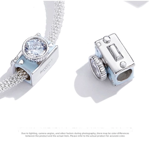 Close-up of S925 sterling silver camera charm with blue enamel and crystal for bracelet