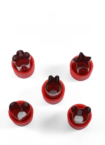 Detail of 5 stainless steel vegetable cutters in flower heart star and animal shapes