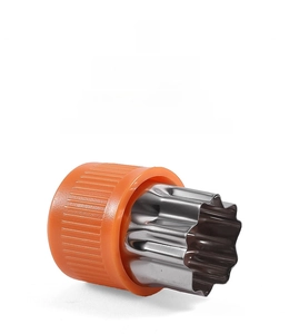 Close-up of a star-shaped stainless steel cutter with an orange ergonomic handle