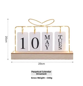 Detail of wooden desk calendar with gold metal frame, LED lights, and dimensions display