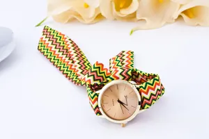 Detail of colorful striped fabric strap tied in a bow on a Geneva women quartz watch