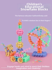 Close-up of colorful interlocking snowflake building blocks showing diverse creative shapes