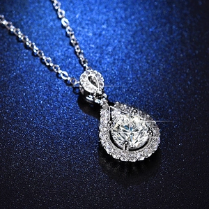 Macro shot of a teardrop-shaped pendant with a sparkling round moissanite stone