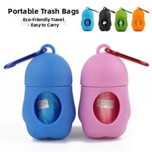 Portable paw-shaped pet waste bag dispenser with carabiner and colorful storage capsule