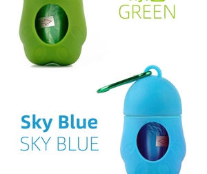 Detail view of green and sky blue pet waste bag dispensers with metal carabiner clips
