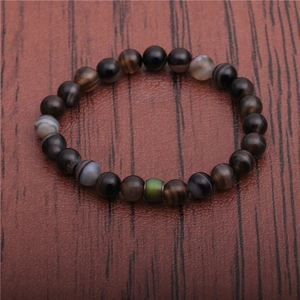 8mm beads mood bracelet with temperature sensitive color changing stone on wood background