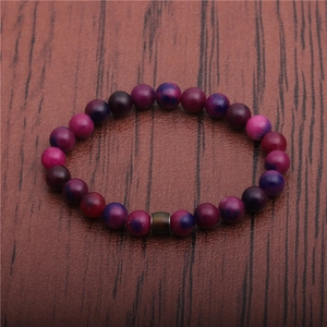 Minimalist 8mm thermochromic color changing mood bead bracelet on wood background