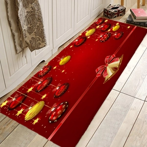 Detailed macro view of Christmas flannel mat showing golden bells and red holiday patterns