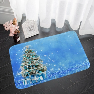 Detail of blue Christmas flannel floor mat with tree pattern on dark wood floor