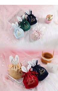 Detail of velvet bunny ear candy bags with pearls and Sweet Moment gold lettering