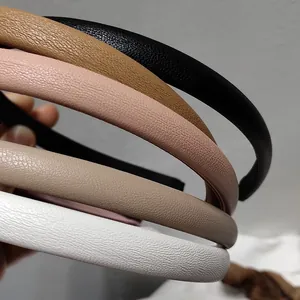 Detail of colorful faux leather headbands set with thick sponge and lychee grain texture