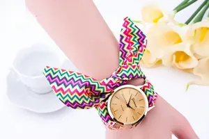 Close-up of Geneva women's watch with colorful wave pattern fabric bow strap on wrist
