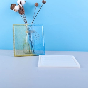 Square silicone coaster mold for DIY epoxy resin with a sparkling gradient finished product