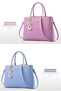 Detail of lavender and sky blue tote bags with quilting and pearl pendant charms