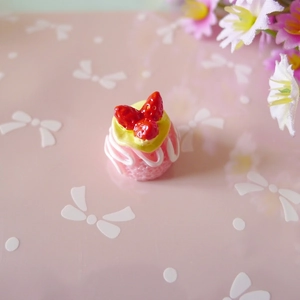 Detailed top view of miniature resin strawberry cream cake for DIY crafts and decor