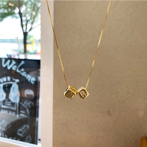 Gold plated necklace with micro-pave zircon dice alphabet pendants in polished finish