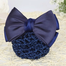 Close-up of professional navy blue hairnet with large satin bow for bank staff