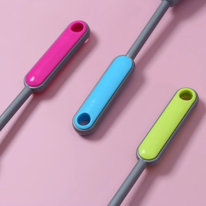 Detail of colorful ergonomic plastic handles with hanging holes for keyboard cleaning brushes