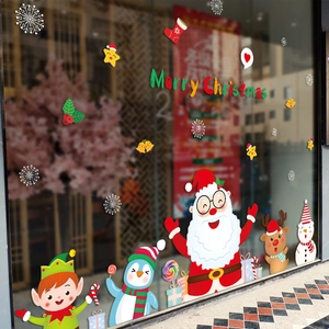 Vibrant Christmas window stickers featuring Santa and reindeer on a festive glass storefront
