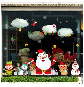 Festive Christmas window decals featuring Santa, snowman and reindeer on glass display