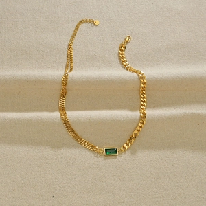 Asymmetric gold titanium steel necklace featuring a green square zircon gemstone pendant