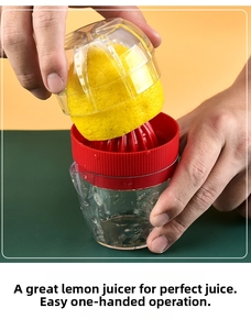 Detailed macro showing the manual citrus juicer squeezing fresh lemon juice into cup