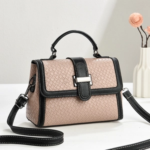 Pink woven texture handbag with black trim and white stitching for office commuting style