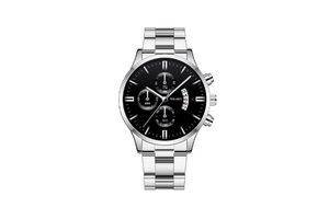 Macro view of black dial chronograph watch showing date window and steel link band