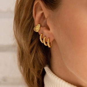 Golden C-shaped twisted rope hoop earrings and ear cuff set for a retro textured look