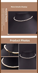 Detailed close-up of natural white freshwater pearls with golden lobster clasp and chain